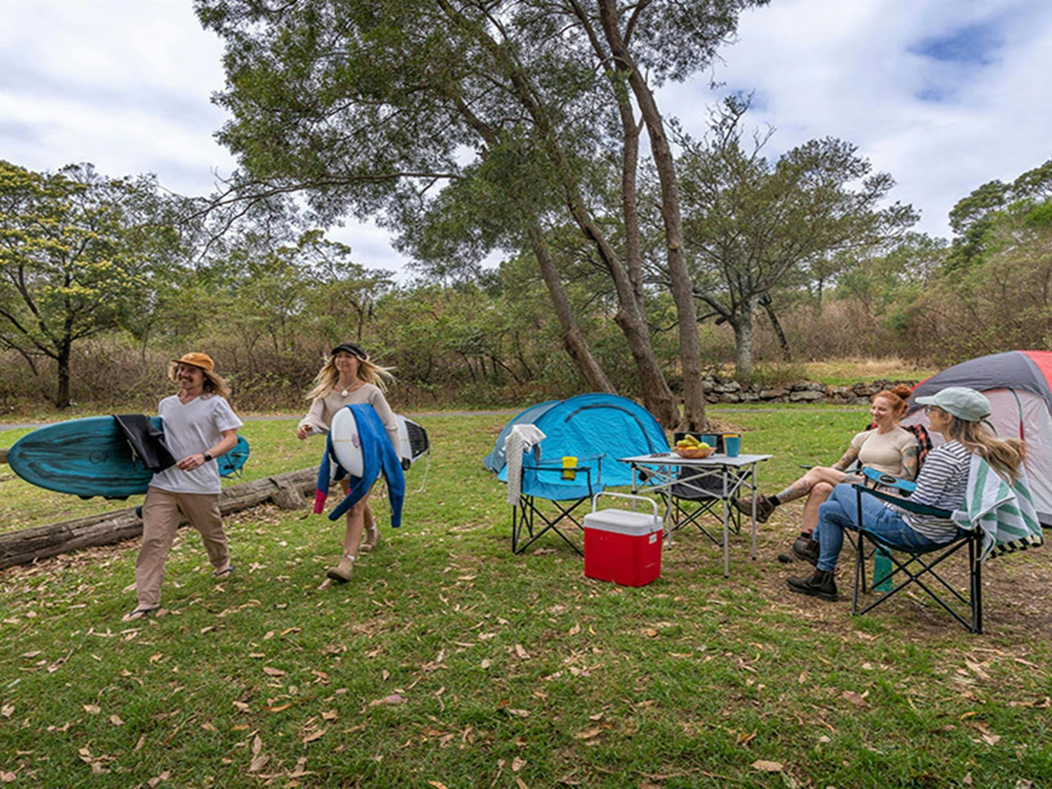 A small group of campers at Killalea campground. Photo: John Spencer/DCCEEW &copy; DCCEEW