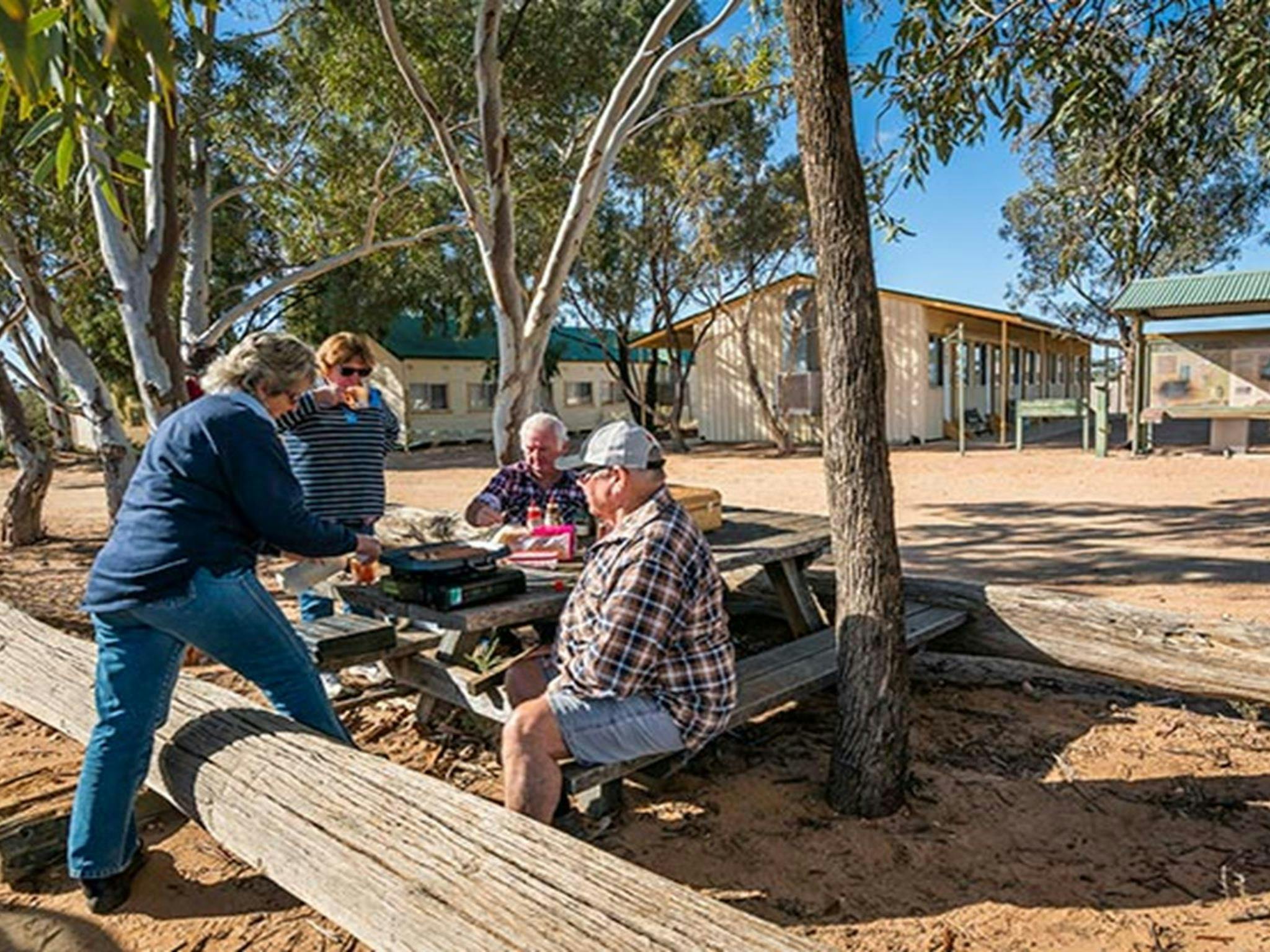 Visitors having a picnic lunch outside Kinchega Shearers Quarters. Photo: John Spencer/DPIE