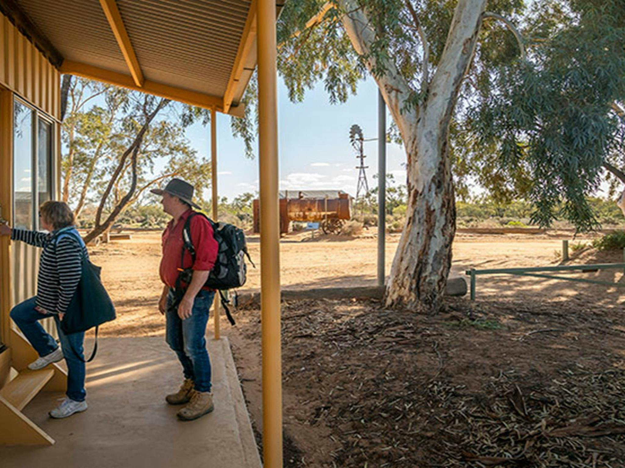 Guests on the porch of their room at Kinchega Shearers Quarters. Photo: John Spencer/DPIE