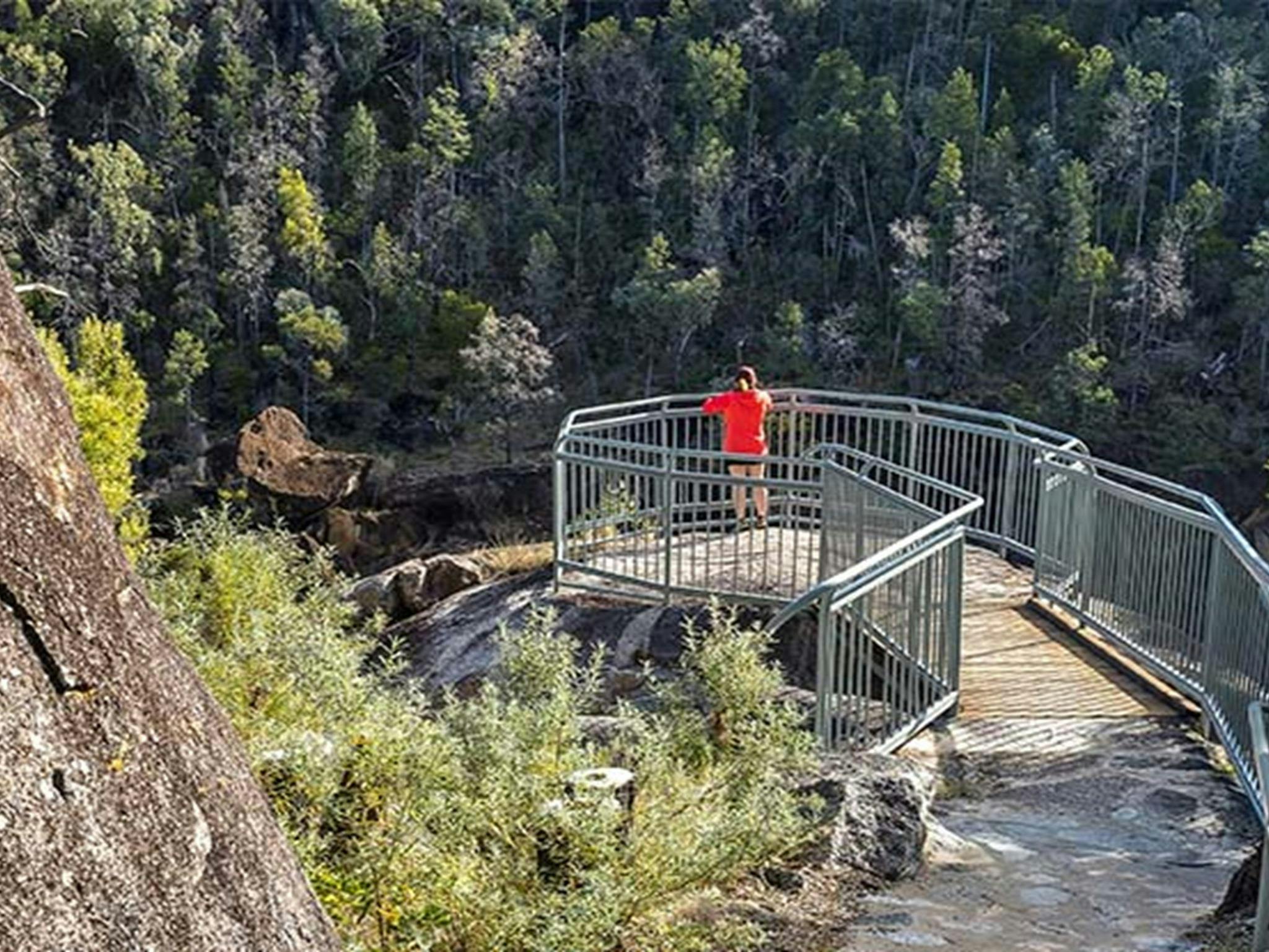 Visitor on a lookout over Macintyre Falls, Kwiambal National Park. Photo: DPE