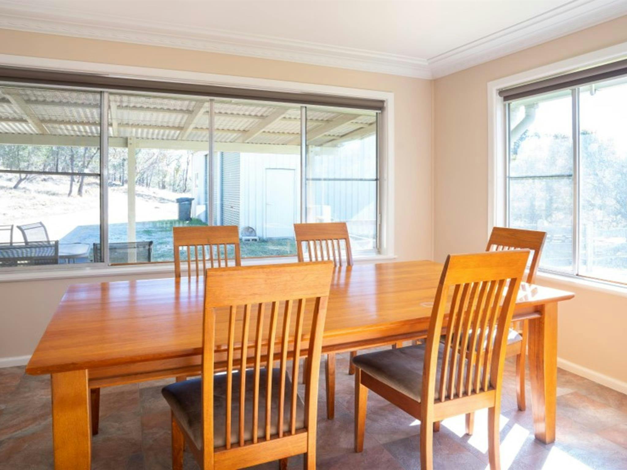 A dining table and chairs at Lavender Vale Cottage in Kwiambal National Park. Photo &copy; DPE