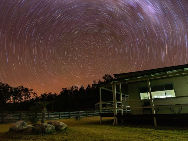Stars travelling across the sky behind Lavender Vale Homestead in Kwiambal National Park. Photo