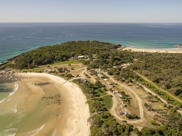 An aerial photo of Point Plomer campground and nearby beach in Limeburners Creek National Park.