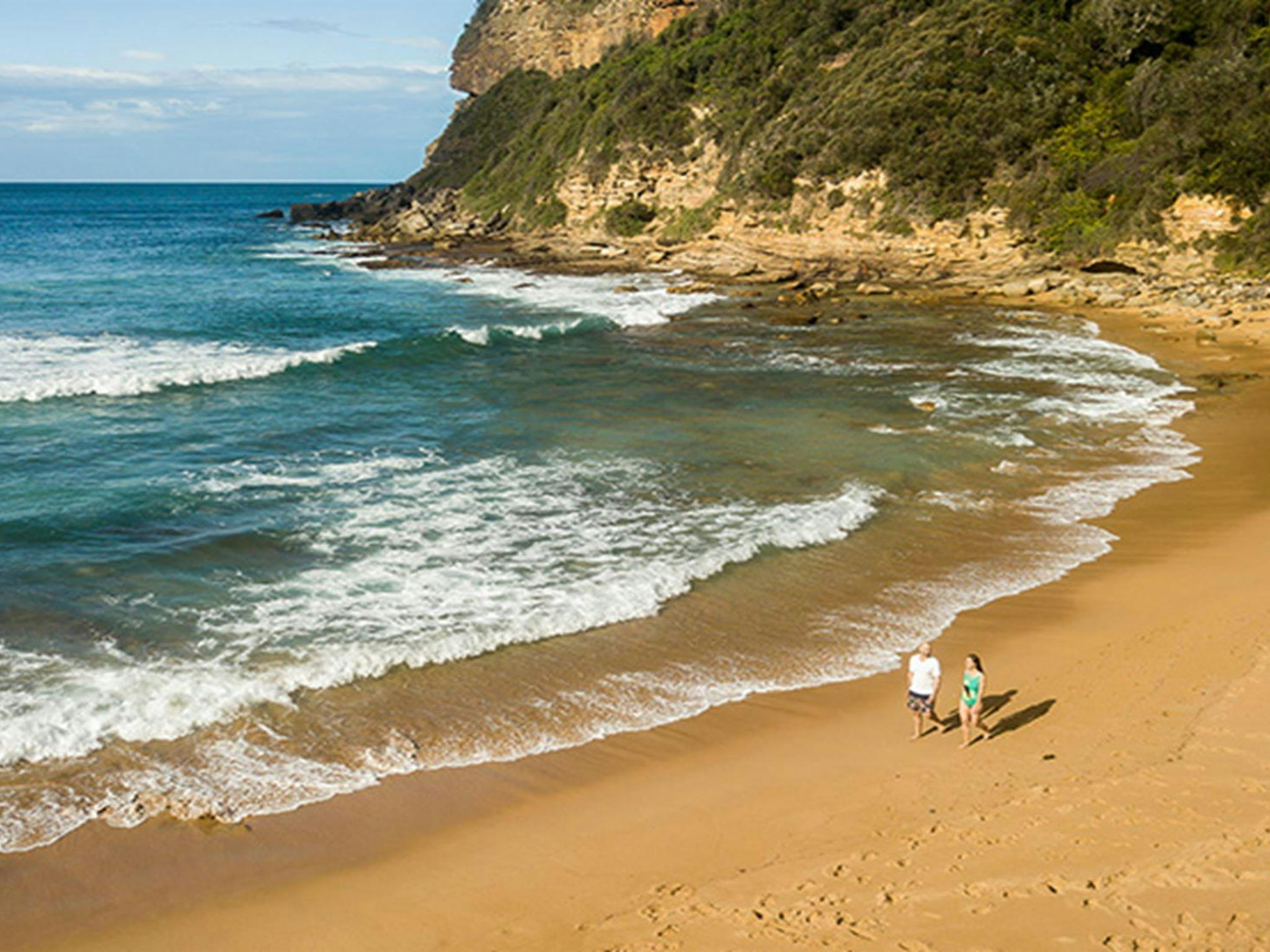 Aerial view of 2 people walking along Little Beach, Bouddi National Park. Photo: John Spencer/DPIE.