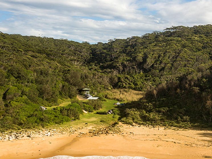 Aerial view of Little Beach and campground showing toilet and barbecue facilities, Bouddi National