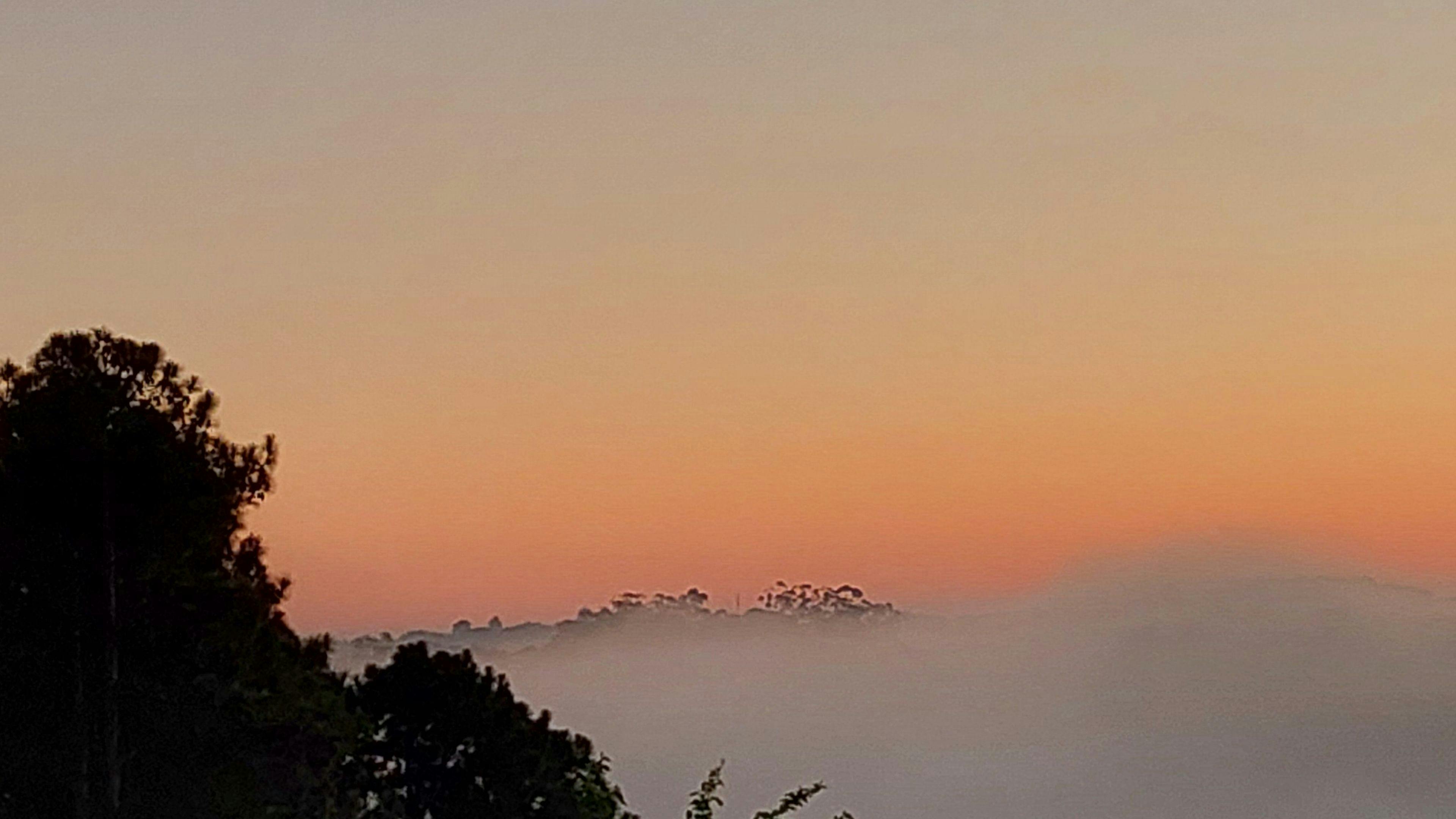 Sunrise morning fog over the valley camp-site.