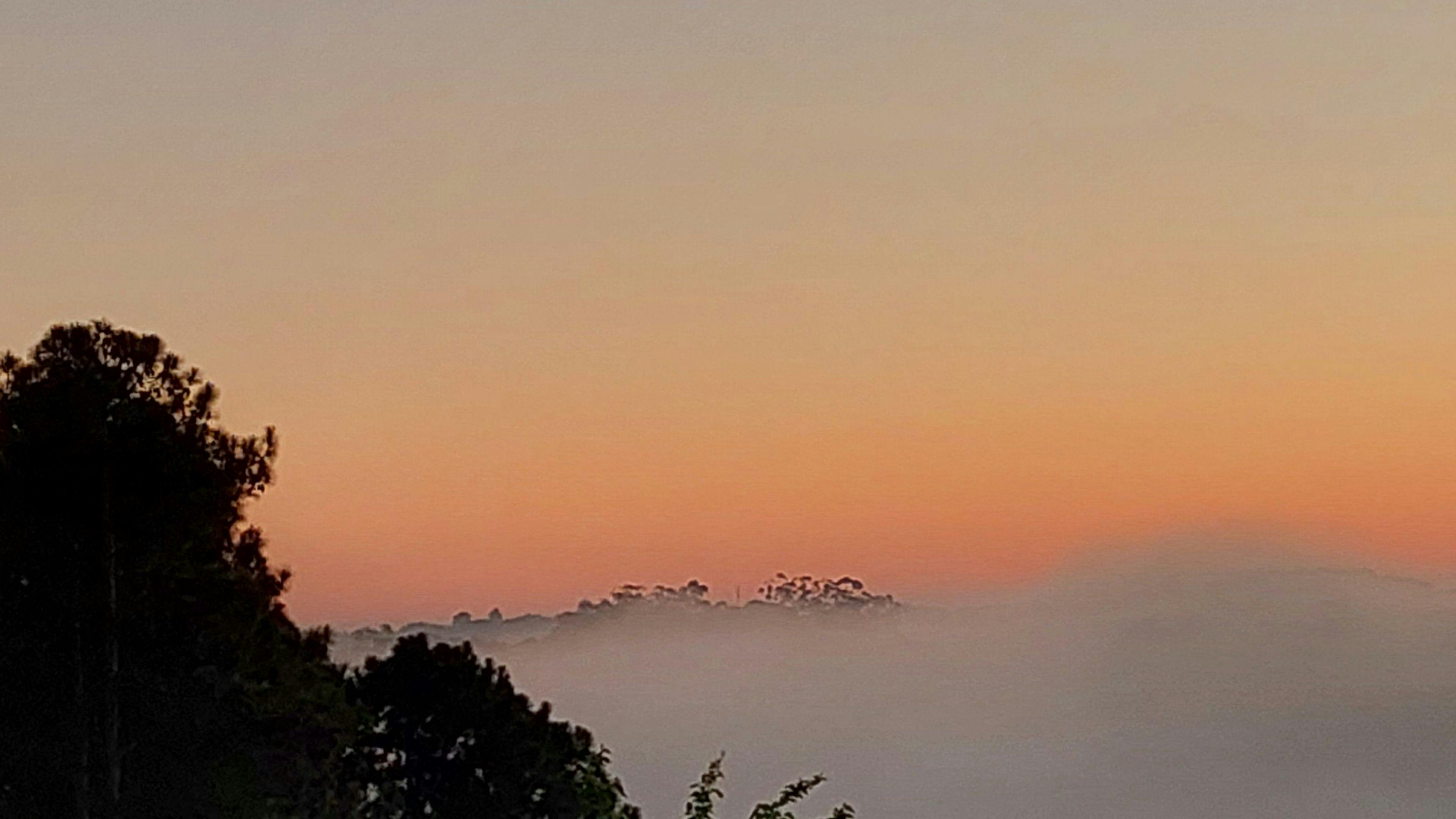 Sunrise morning fog over the valley camp-site.