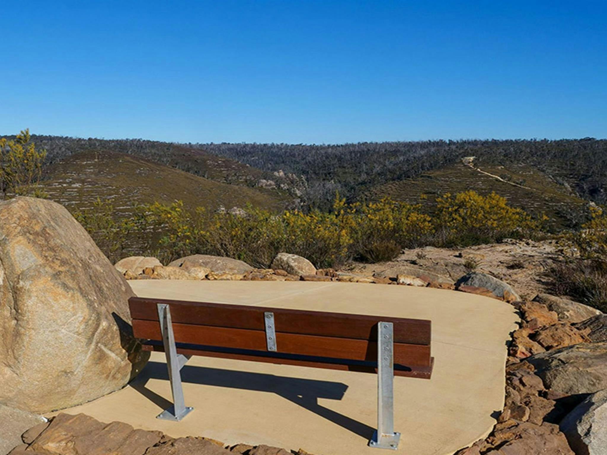 A bench seat on concrete at Lost City North lookout, Gardens of Stone State Conservation Area.