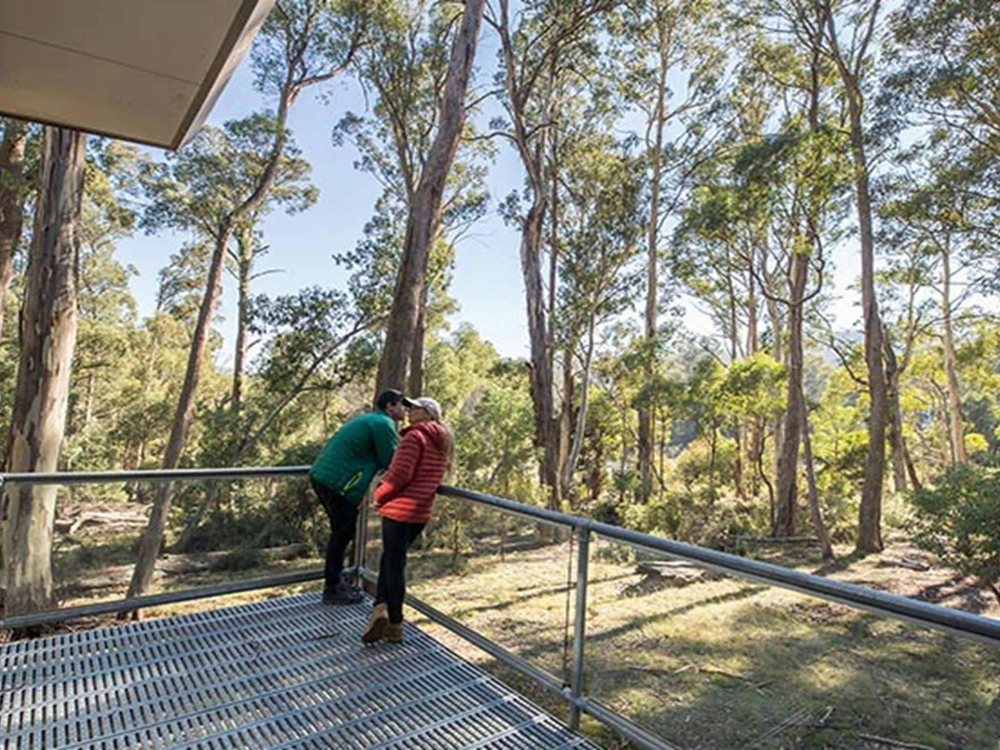 A couple on the verandah at Lyrebird Cottage, Kosciuszko National Park. Photo: Boen Ferguson/OEH.