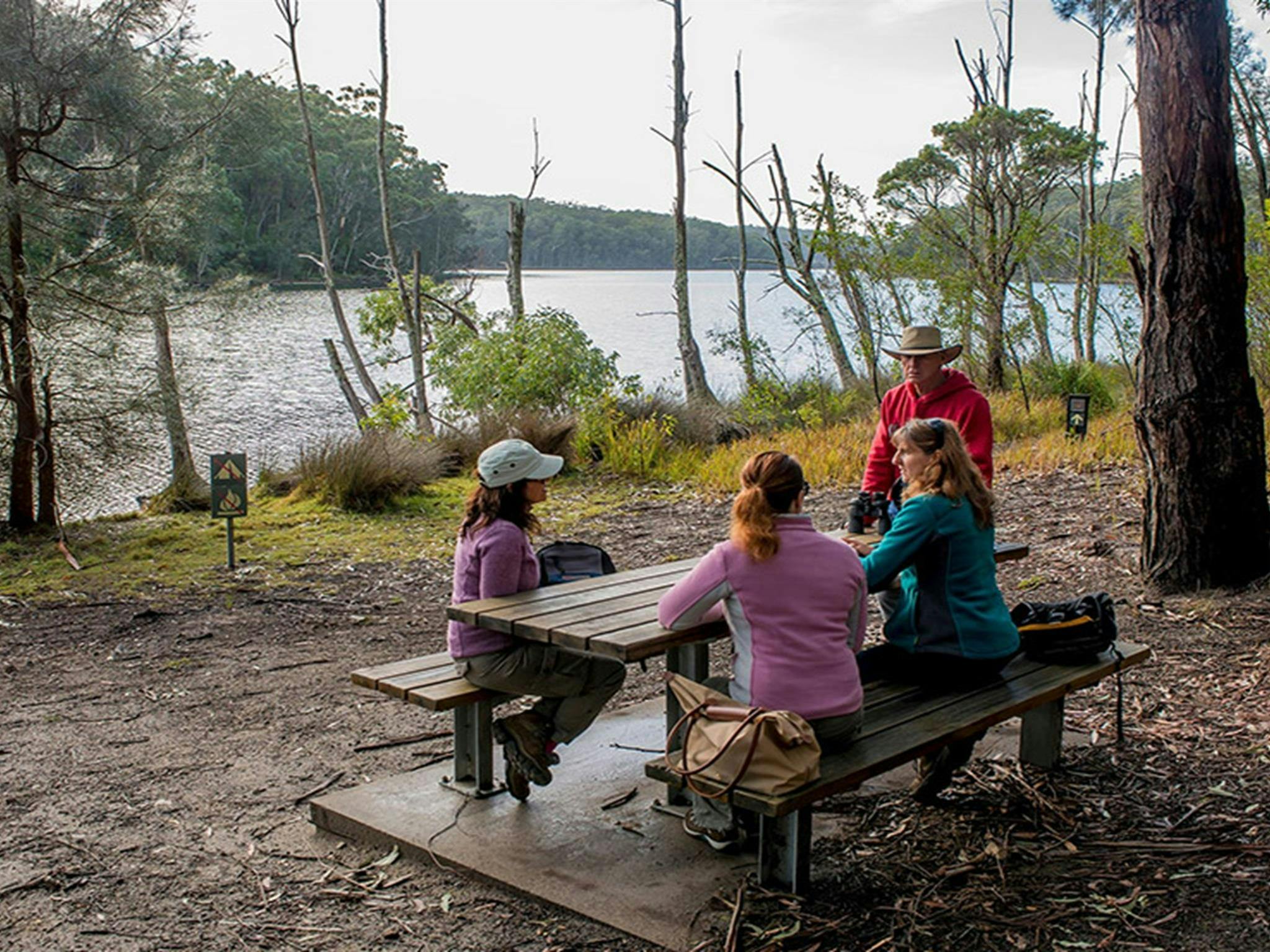 A family resting at a picnic table along Giriwa walking track. Credit: Michael Van Ewijk &copy;