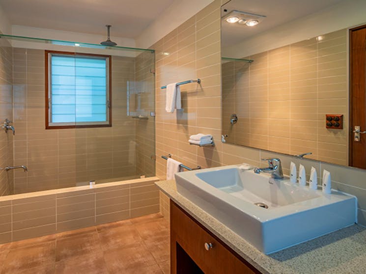 Spacious luxury bathroom with complimentary products, Mildenhall cottage. Photo: DPIE/John Spencer