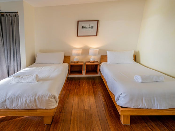 Two single beds in a guest room at Mildenhall cottage. Photo: DPIE/John Spencer
