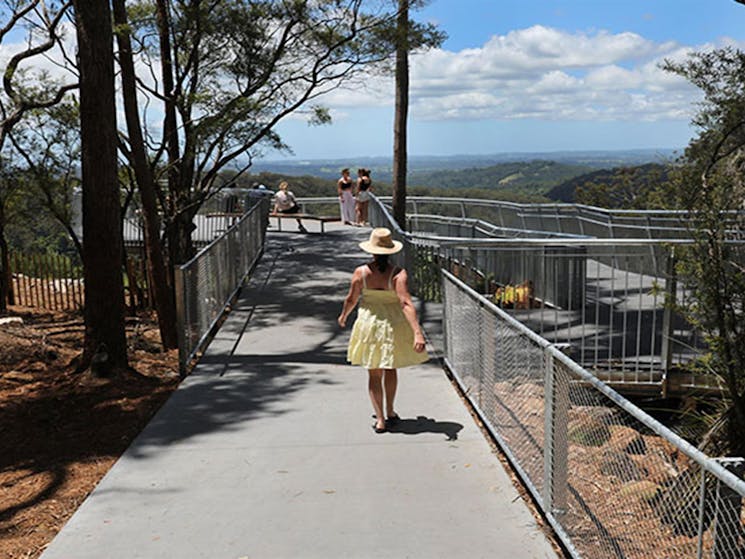 A visitor walking up to Minyon Falls lookout, in Nightcap National Park. Photo: Jimmy Malecki &copy;