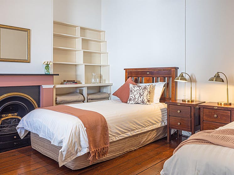 Twin beds in a bedroom at Montague Island Assistant Lighthouse Keeper's Cottage. Photo: David