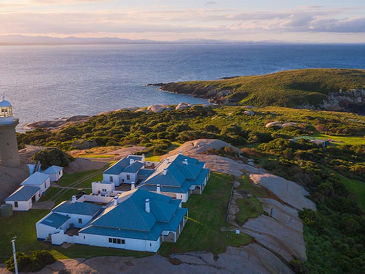 Aerial view of Montague Island Lighthouse and cottages at sunset. Photo: Daniel Tran/OEH