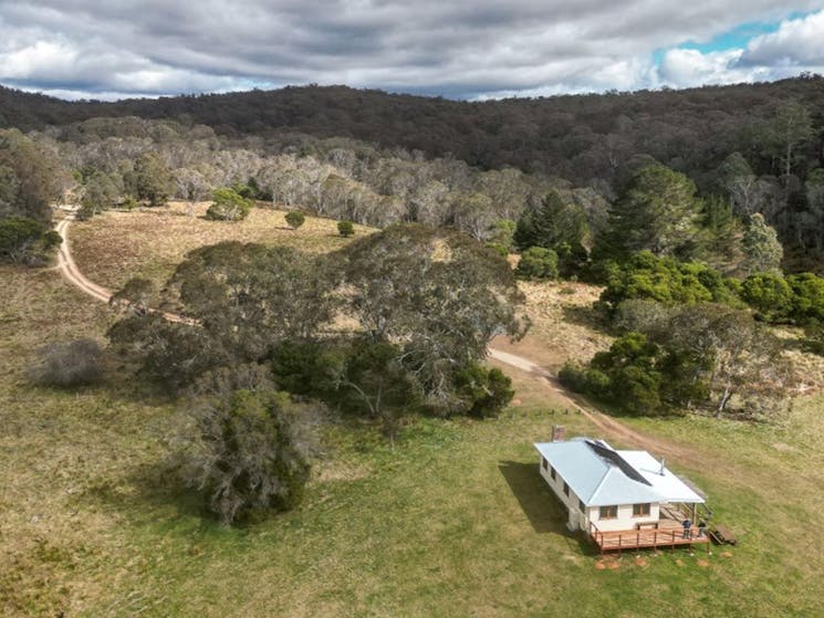 An aerial shot of Mooraback Cabin surrounded by World Heritage-listed Gondwana rainforest in