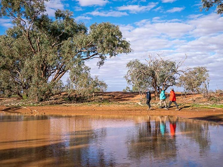 Friends walking along the bank of the billabong at Mount Wood campground. Photo: John Spencer/DPIE