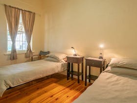 Bedroom with 2 single beds at Mount Wood Homestead. Photo: John Spencer/DPIE
