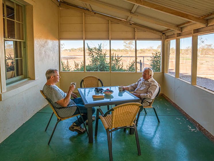 Guests having tea on the enclosed back verandah at Mount Wood Homestead. Photo: John Spencer/DPIE