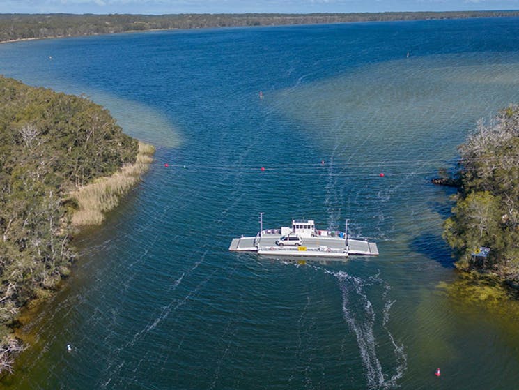 An aerial photo of Bombah Point car ferry, crossing the lake in Myall Lakes National Park. Credit: