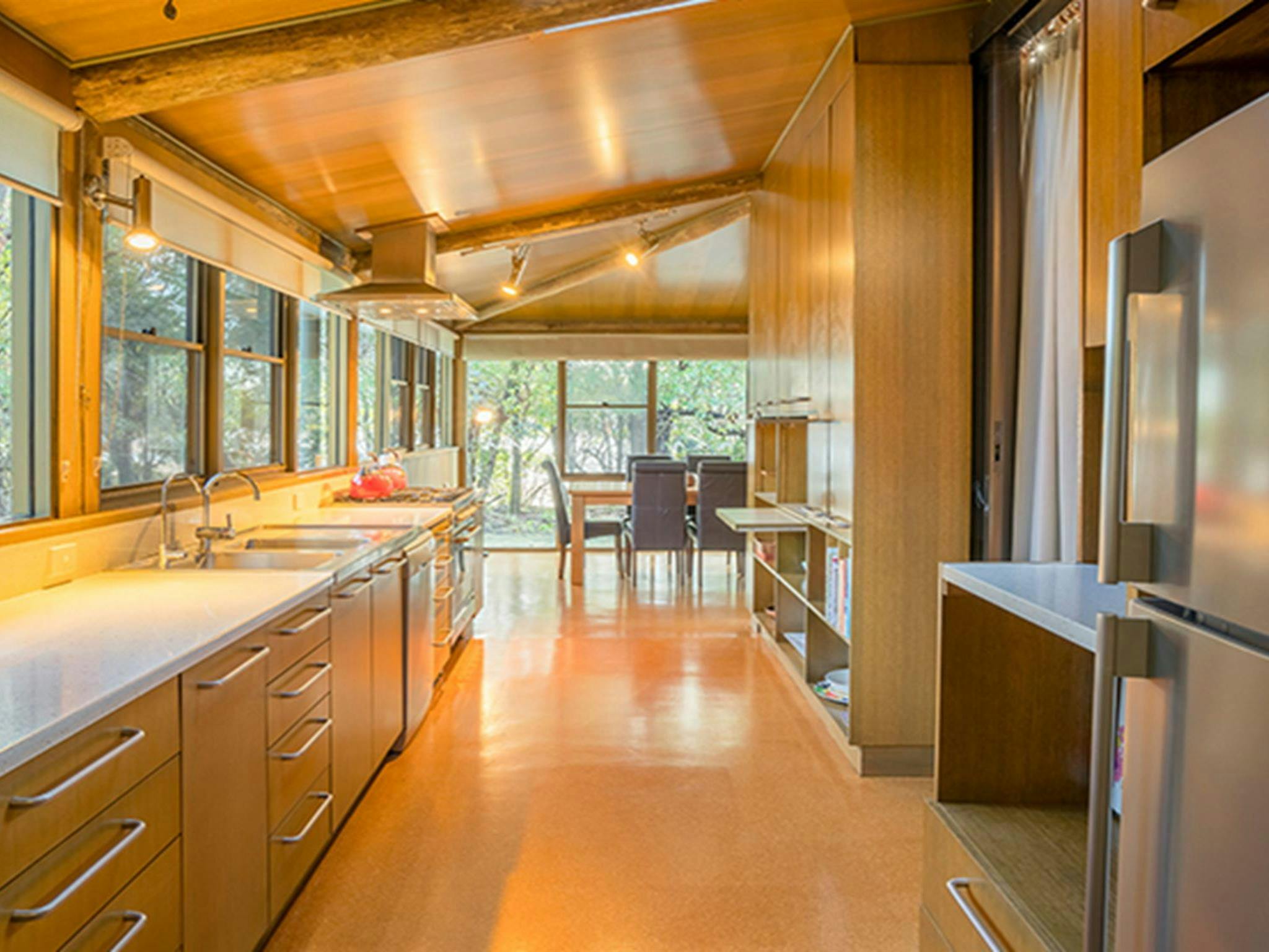 Photo of the long kitchen and dining table at Myer House. Photo: OEH/John Spencer