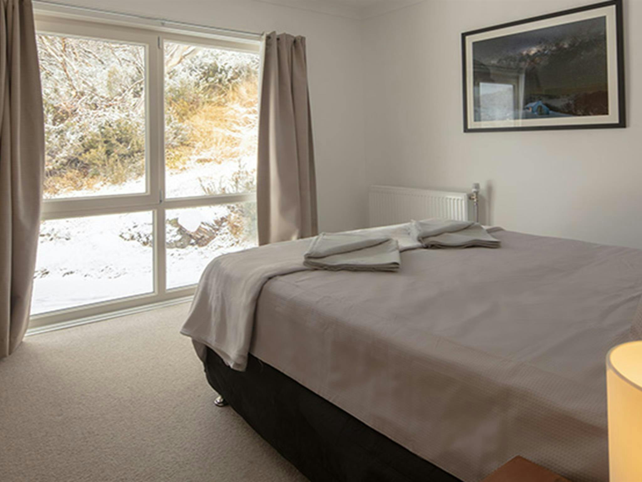 Queen bedroom in Numbananga Lodge, Kosciuszko National Park. Photo: Murray Vanderveer/OEH