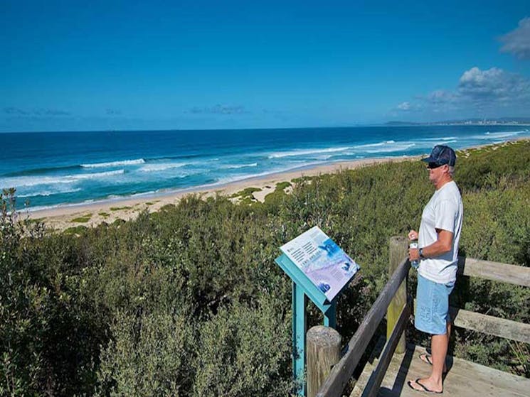 Man at Pelican Beach lookout. Photo: John Spencer