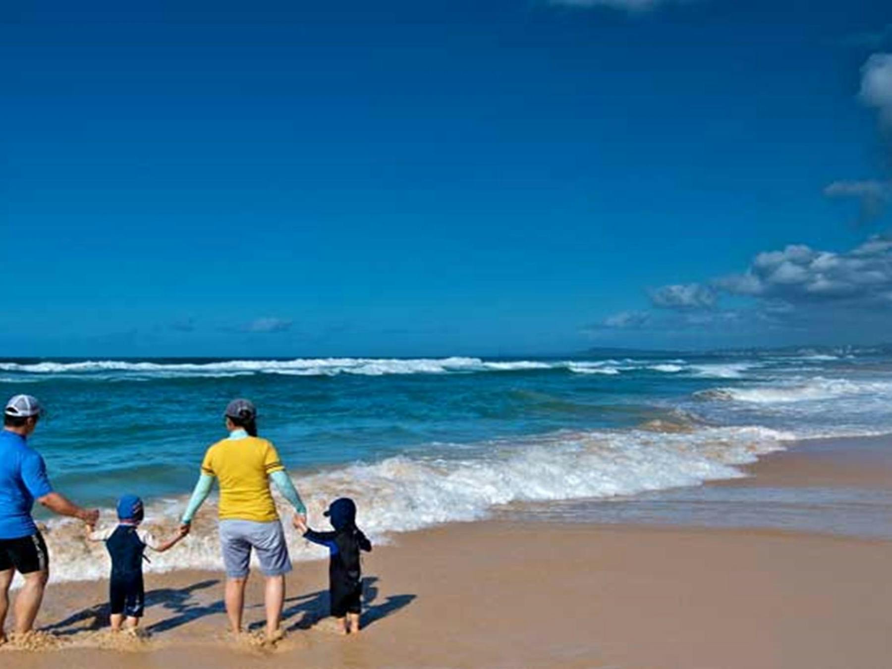 Family at the Pelican Beach shore. Photo: John Spencer/OEH