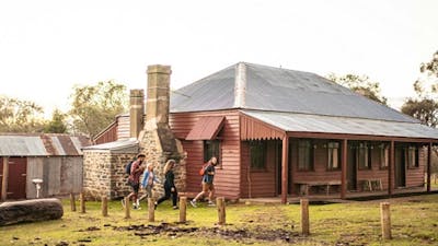 Visitors walking to The Pines Cottage, Kosciuszko National Park. Photo: Rob Mulally/DPIE