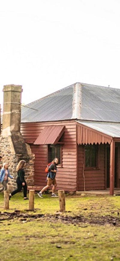 Visitors walking to The Pines Cottage, Kosciuszko National Park. Photo: Rob Mulally/DPIE