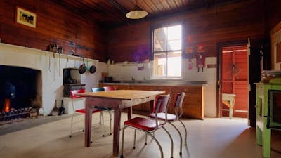 Kitchen and dining area in The Pines Cottage, Kosciuszko National Park. Photo: Murray Vanderveer/OEH