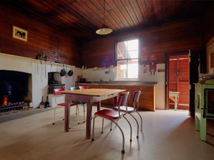 Kitchen and dining area in The Pines Cottage, Kosciuszko National Park. Photo: Murray Vanderveer/OEH