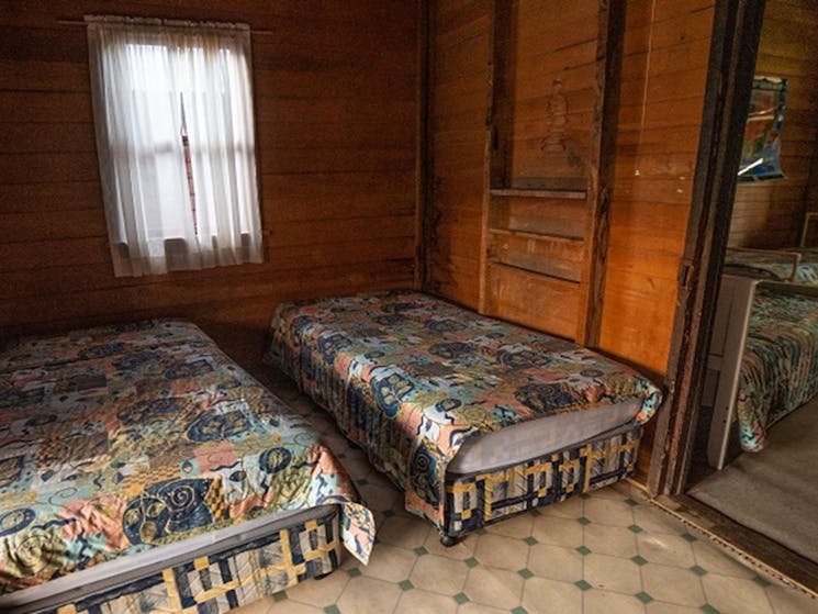 Two single beds at The Pines Cottage, Kosciuskzo National Park. Photo: Rob Mulally/DPIE