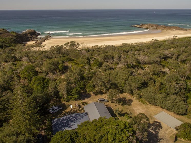 An aerial photo of Plomer Beach House and coastal views at Limeburners Creek National Park. Photo: