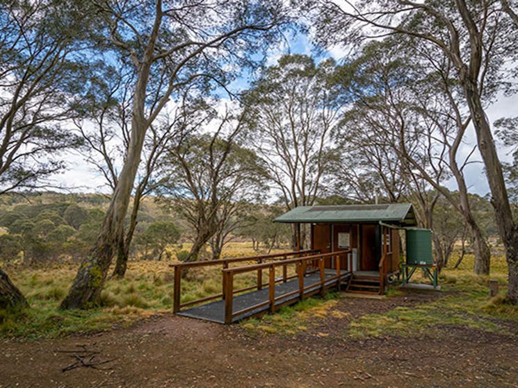 Amenities building set amongst trees in Polblue campground and picnic area, Barrington Tops National