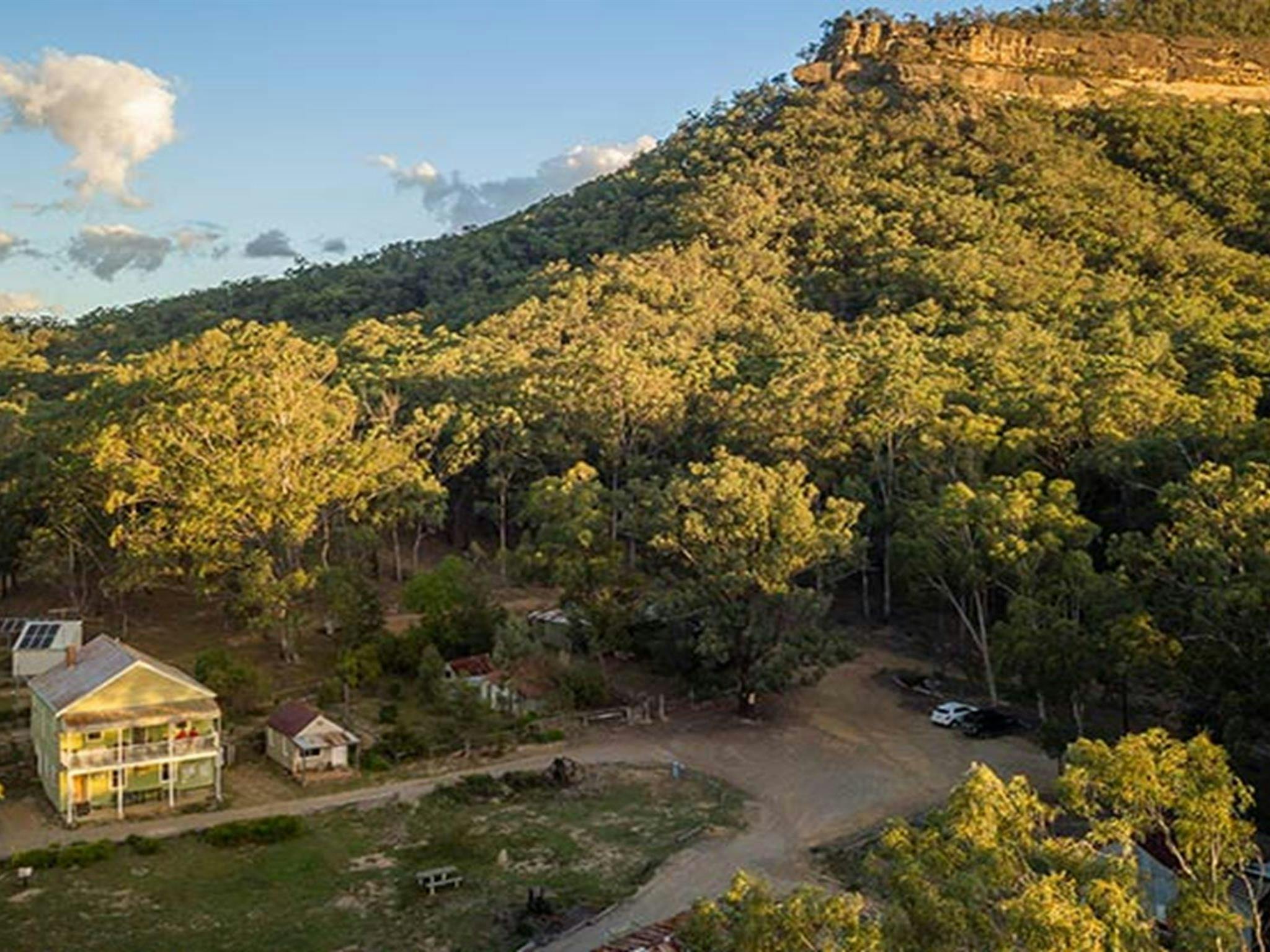 Arial view of Post Office Lodge in Yerranderie Private Town, surrounded by the rugged landscapes of