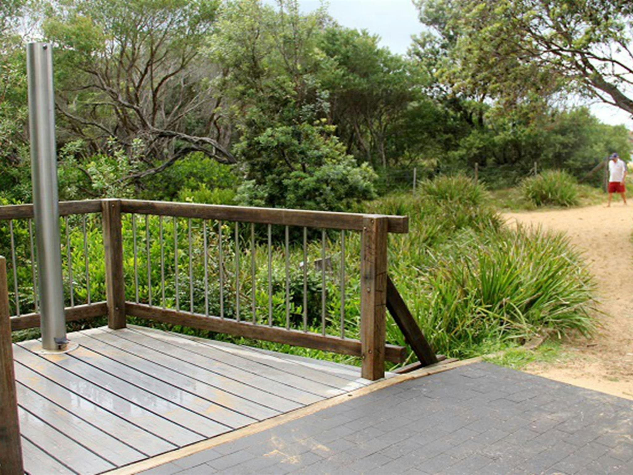 Outdoor shower area at Putty Beach campground in Bouddi National Park. Photo: John Yurasek/OEH