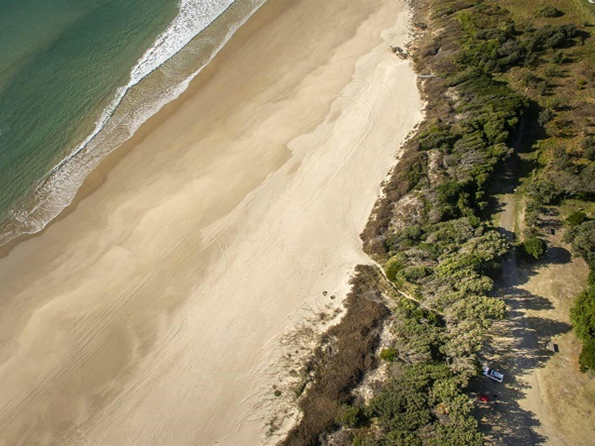 Aerial photo of Racecourse campground, nearby Goolawah Beach, beach access and carpark. Photo: John