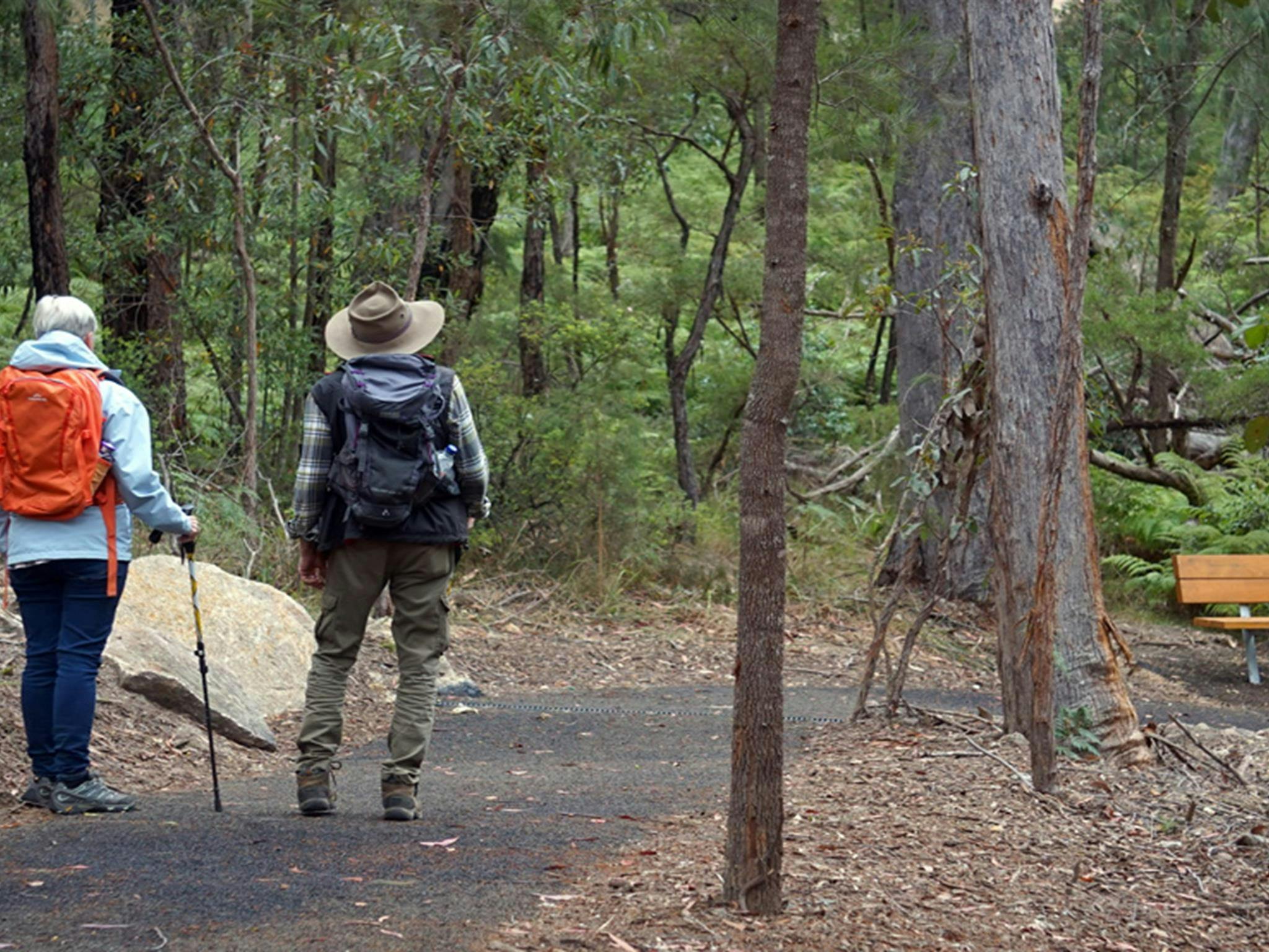 People approaching a seat on Rockpools View walk, Boonoo Boonoo National Park near Tenterfield.