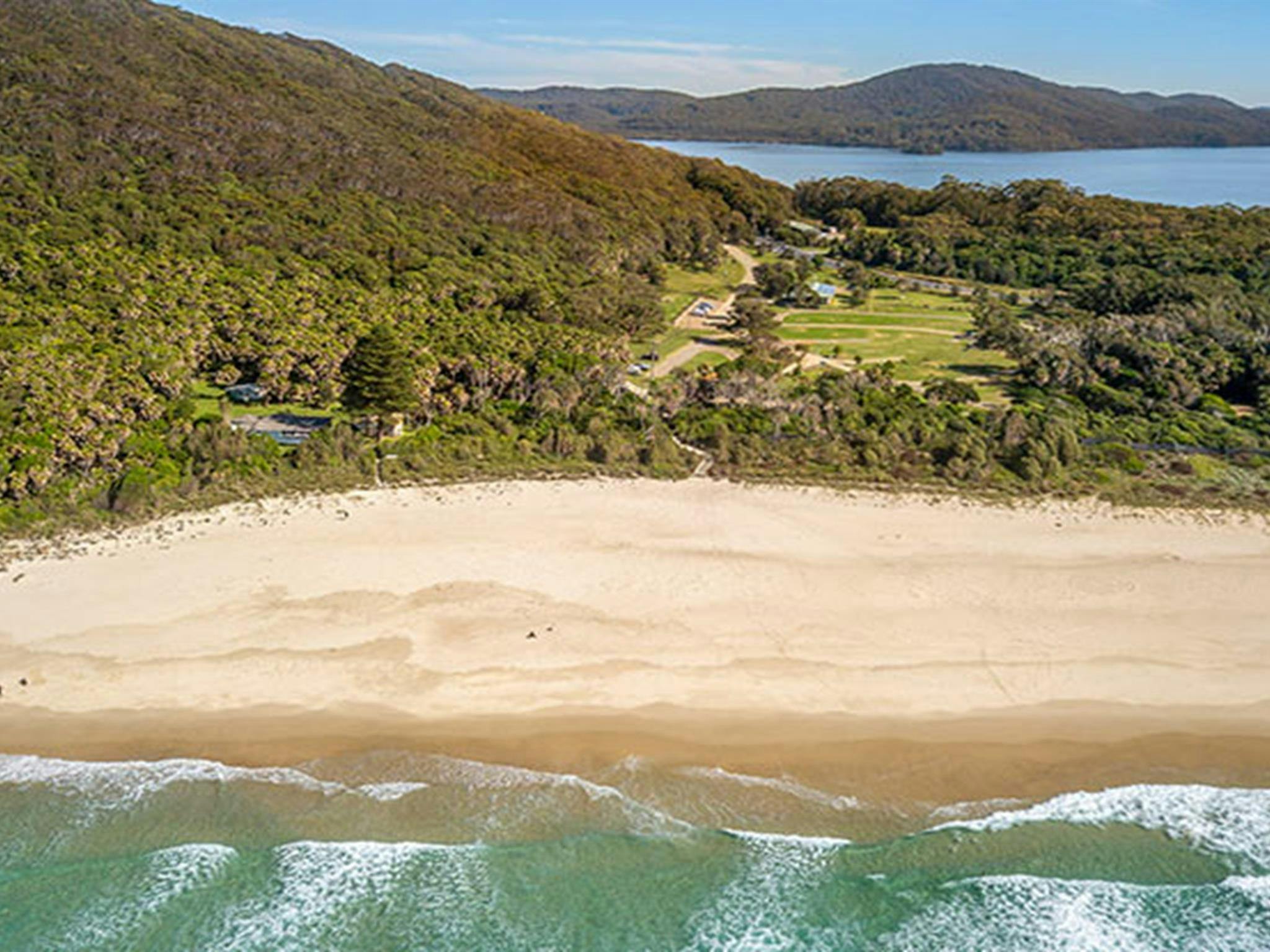 Arial shot of The Ruins campground in Booti Booti National Park, between Wallis Lake and Seven Mile