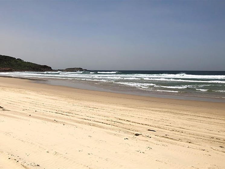 View of the Samurai Beach shoreline with a rocky headland in the distance. Photo: Jim Cutler &copy;
