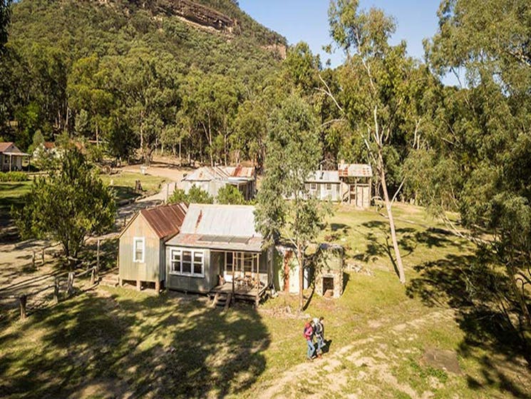 A couple set out on a hike from Slippery Norris Cottage in Yerranderie Regional Park. Photo: John