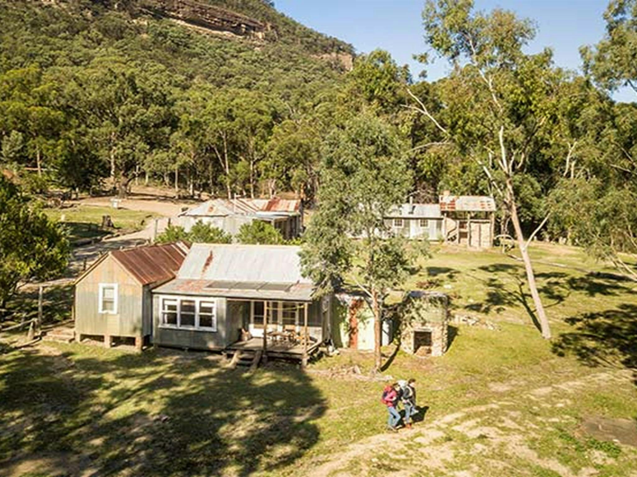 A couple set out on a hike from Slippery Norris Cottage in Yerranderie Regional Park. Photo: John