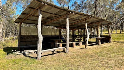 BUSH KITCHEN: picnic table & benches seats 16, food prep bench, x2 gas cookers (BYO LPG gas), double sink (no taps, BYO water), undercover firepit.
