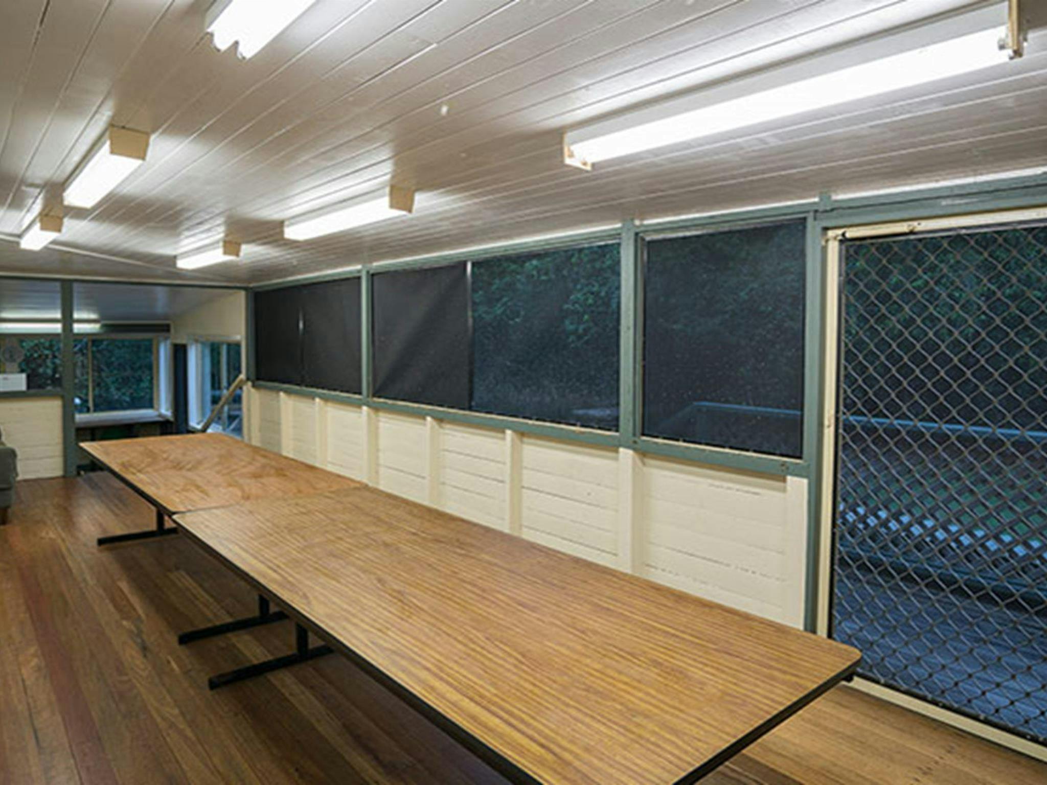 Enclosed dining area and verandah in Swamp House, Bundjalung National Park. Photo: J Spencer/OEH