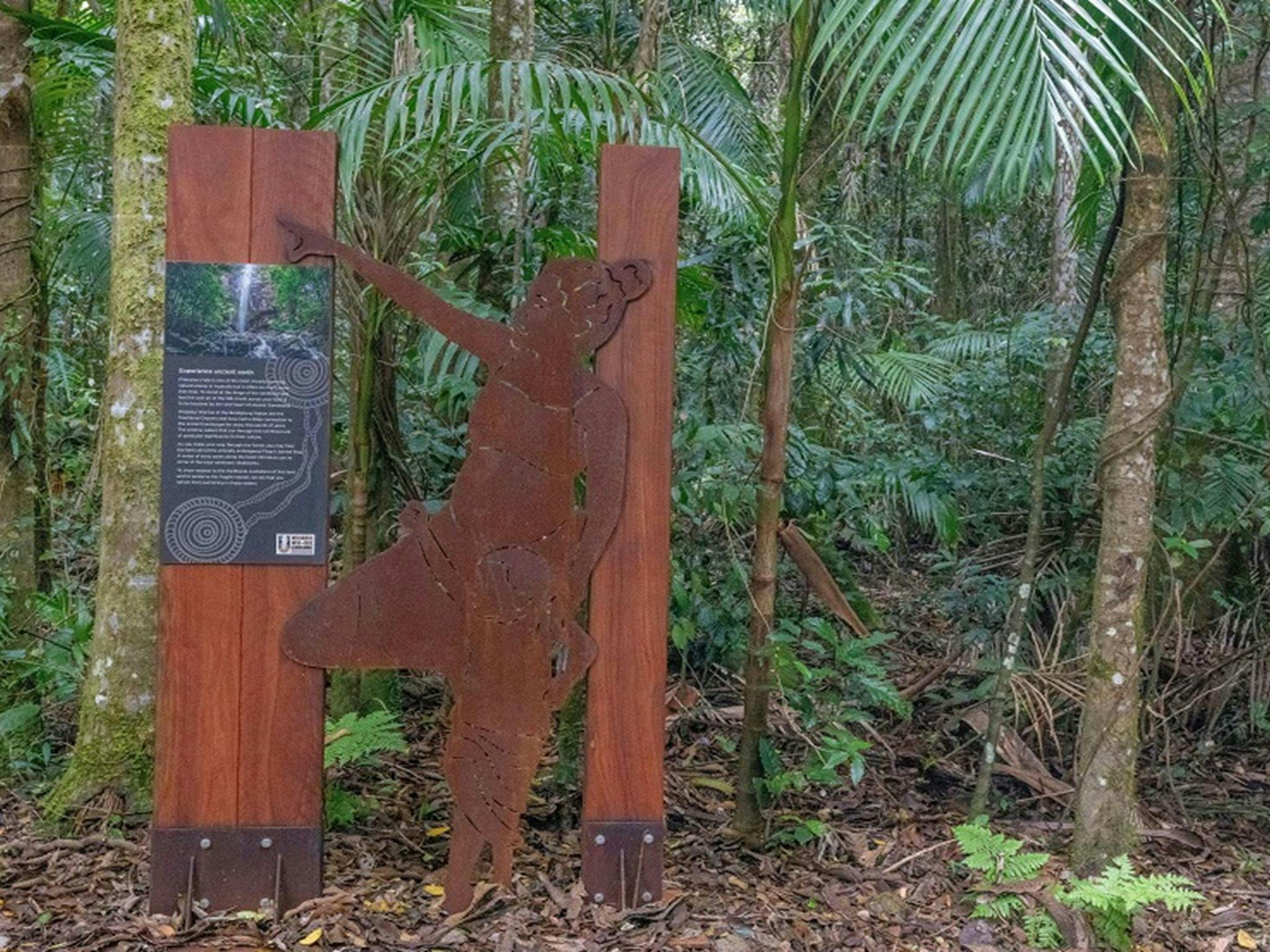 A metal sculpture of an Aboriginal mother and child at Terania Creek picnic area, Nightcap National