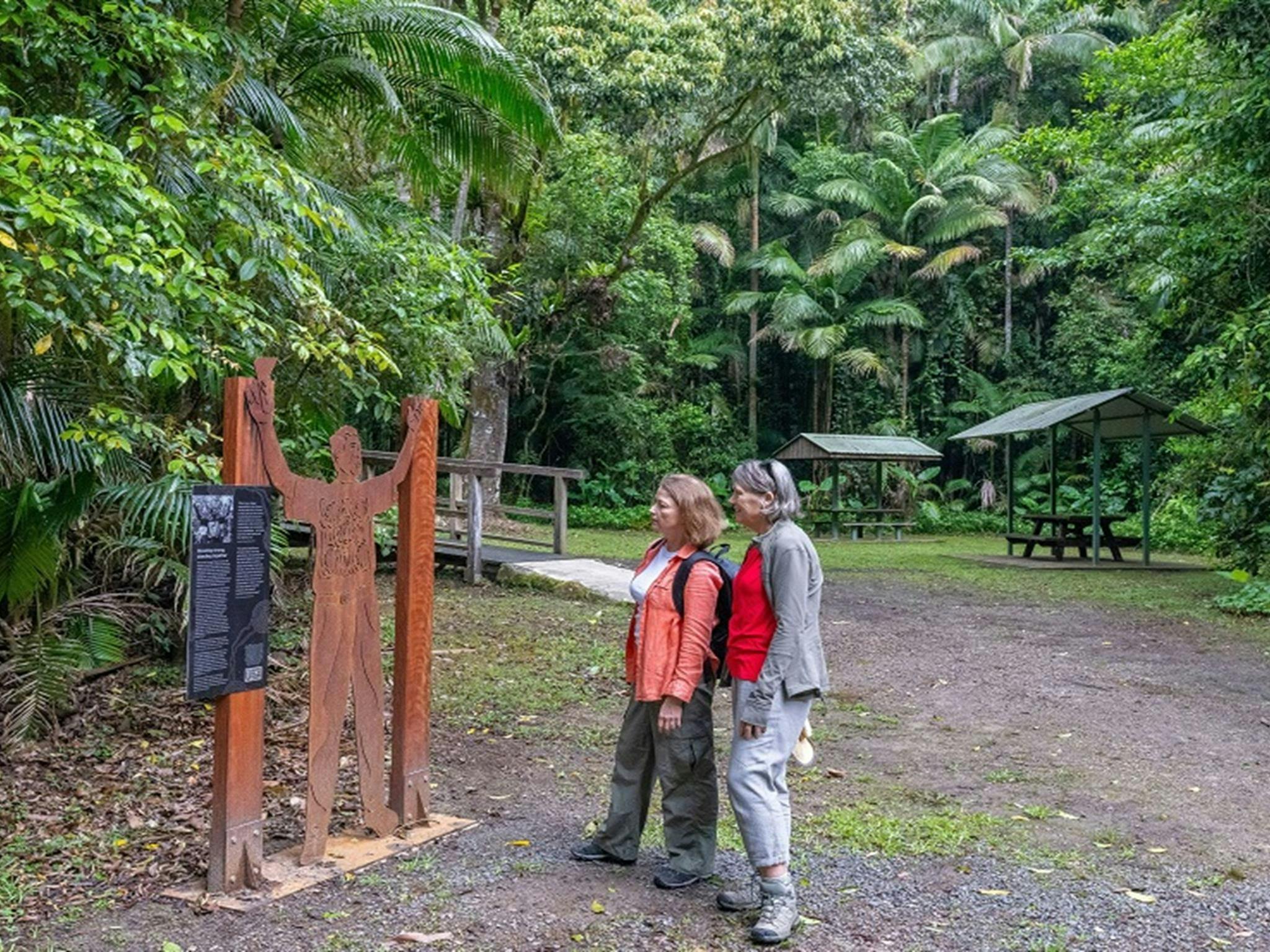 Visitors stop to admire a metal sculpture of Murray John Roberts, who was an Aboriginal elder,