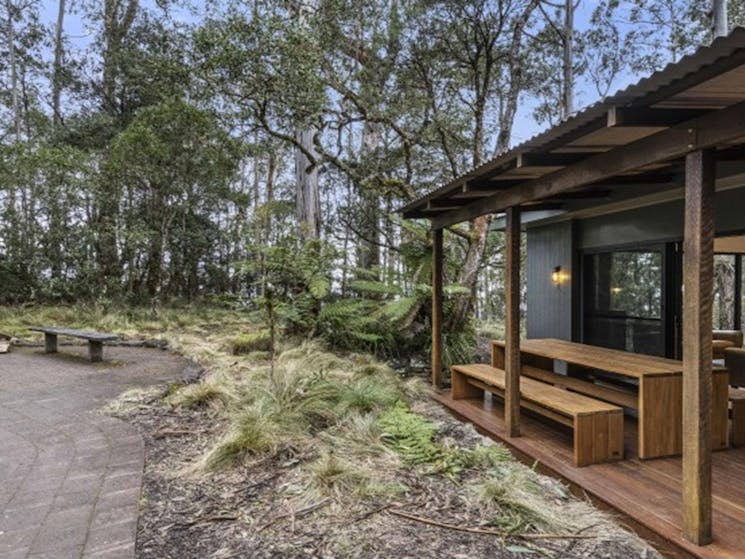 The deck with benches and a table at The Residence, New England National Park. Photo: Mitchell