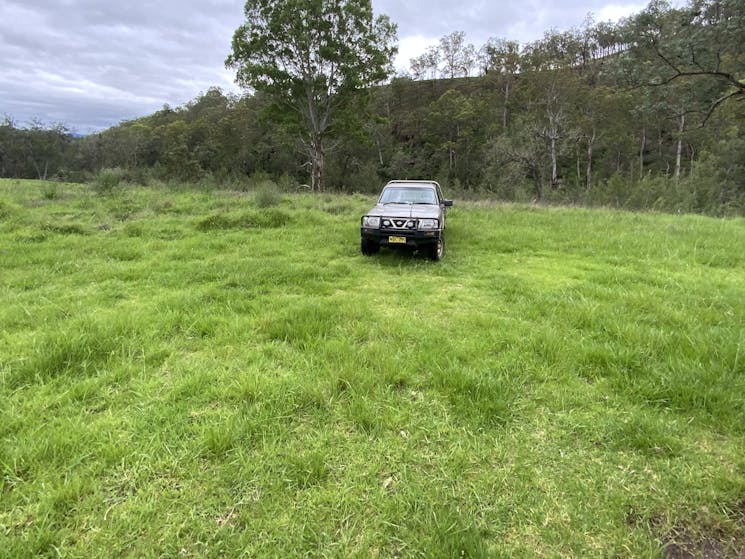 Looking northeast.  The river is over the bank behind the ute.