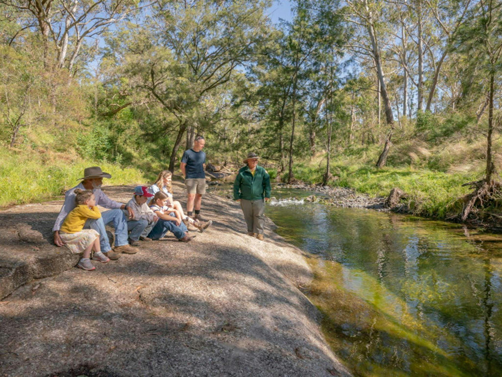 Family and NPWS Ranger on the banks of Middle Brook in Towarri National Park. Credit: John Spencer